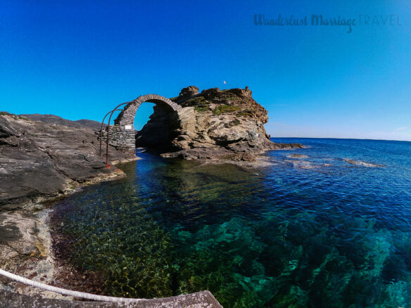 The Venetian Fortress and Bridge in Andros Chora, with a clear blue sky