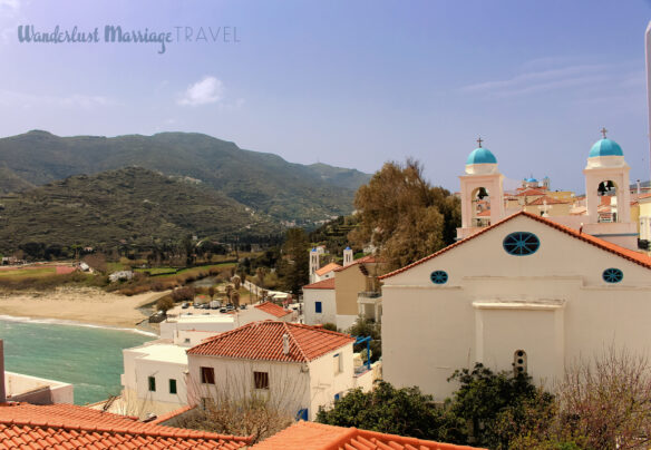 View of Andros Chora, including the mountains, beach and Aegean Sea.