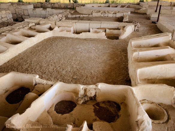 Photo of the ruins of ancient bath tubs arranged in a square