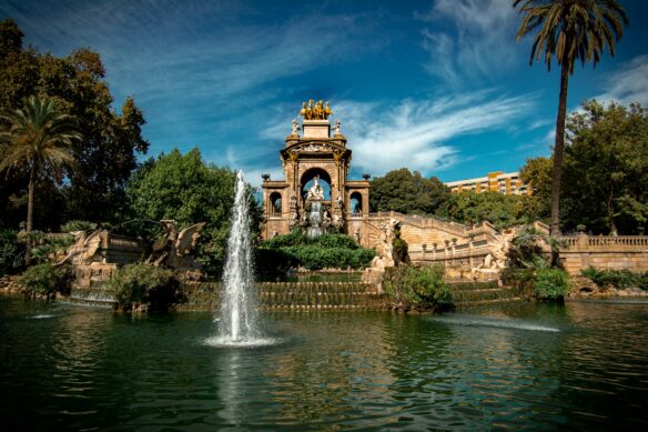 Parc Ciutadella fountain in Barcelona with a blue sky above.