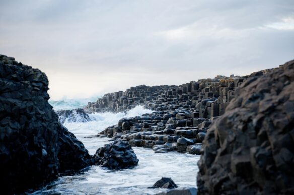 Waves crash up against Giants Causeway in Northern Ireland. 