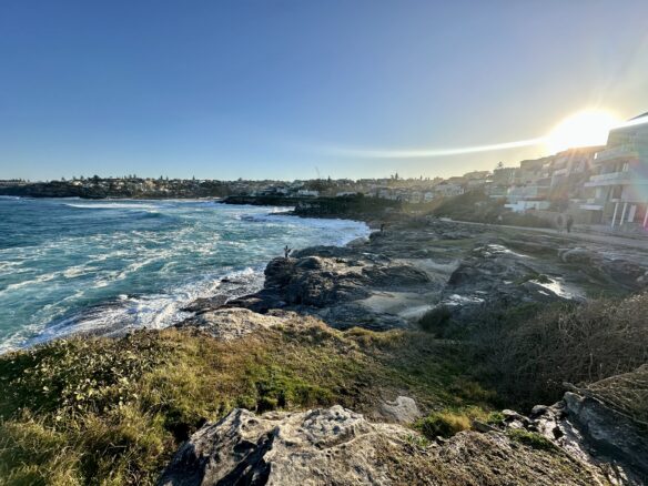 The rocky coast and crashing seaside waves in Tamarama, Australia