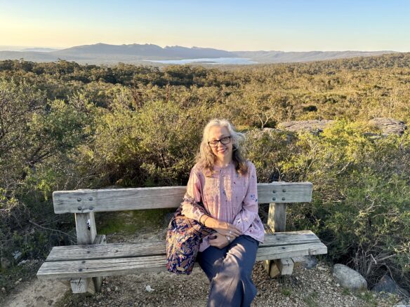 Bell sitting on a bench with a gorgeous view overlooking Grampians National Park