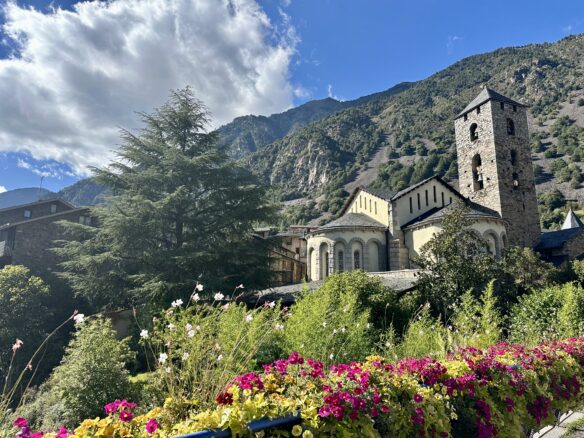 colorful flowers in front of St. Esteve of Andorra Church.