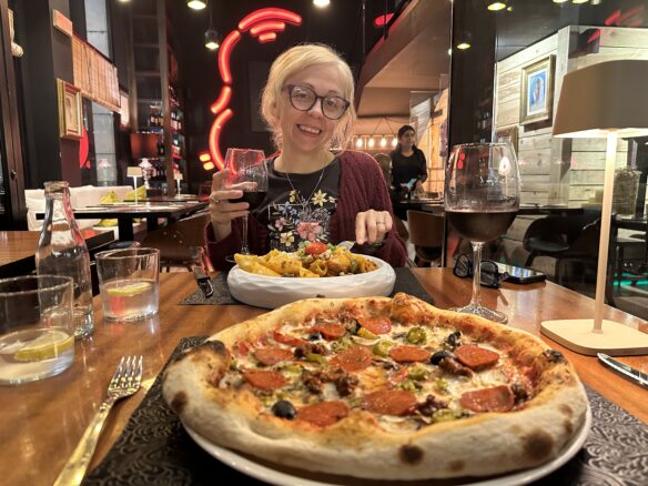 A delicious Andorran dinner - pepperoni and veggie pizza with pasta and red wine in Andorra La Vella