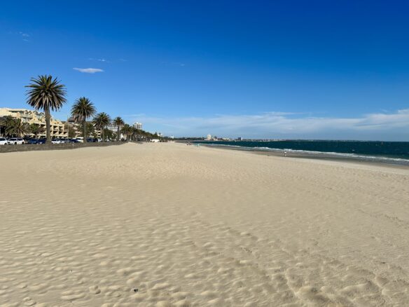 A sandy stretch of Middle Park Beach with no other people in the Albert Park Neighborhood of Melbourne, Australia.