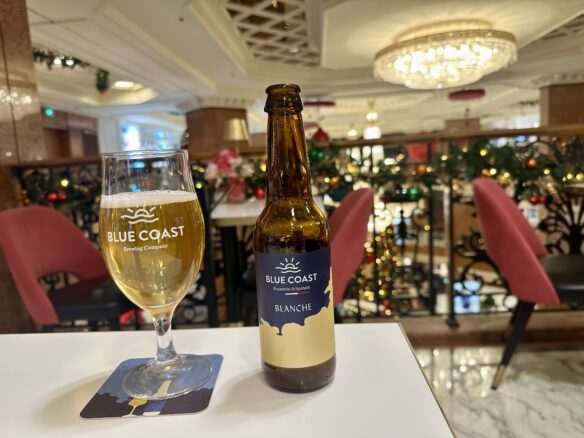 Enjoying a tasty white craft beer brewed in Nice at Metropole Monte Carlo  with a chandelier and Christmas decorations.