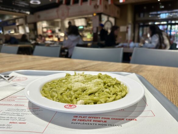 Trofie pasta with pesto topped with aged parmigiano reggiano cheese at Marché de La Condamine