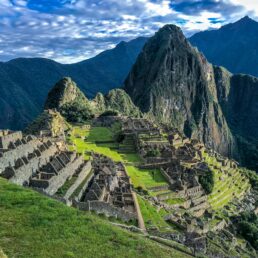 A partly cloudy blue sky over Machu Picchu atop the Andes Mountains in Peru.