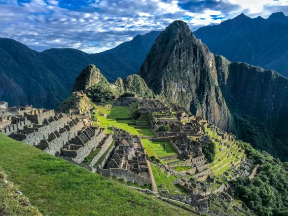 A partly cloudy blue sky over Machu Picchu atop the Andes Mountains in Peru.