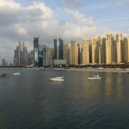 Boats with the skyline of Dubai, UAE in the background.