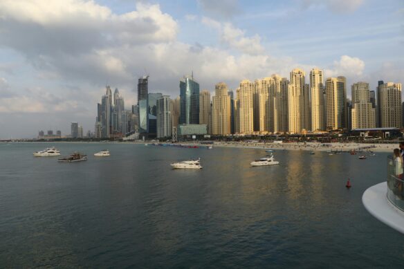 Boats with the skyline of Dubai, UAE in the background.