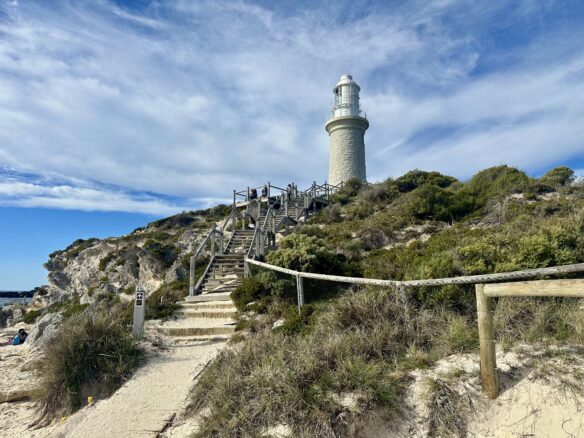 Bathurst Lighthouse perched above sand dunes and brush on Rottnest Island in Western Australia