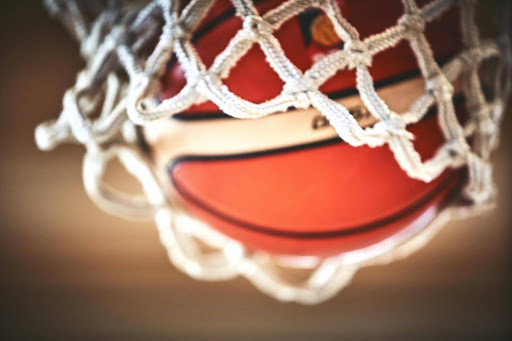 A basketball going through the net