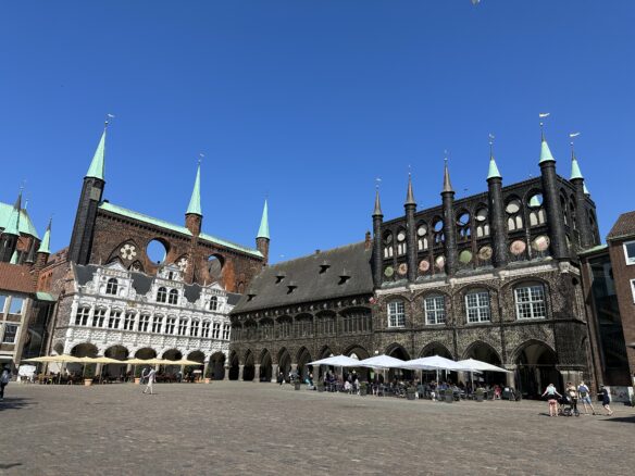 Hansestadt Lübeck (Town Hall) is a 13th century structure featuring unique Gothic architecture and an ornate arcade