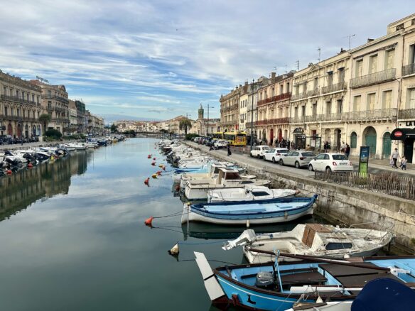 Many small boats docked along the canal in Sete, France