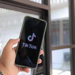 Someone opening the TikTok app on their phone