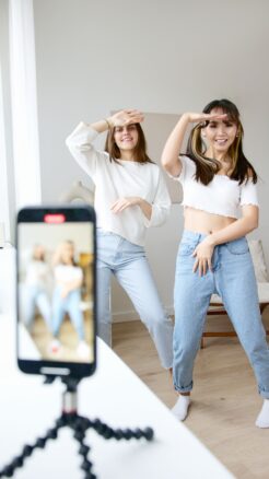 Two girls dancing for a TikTok video shoot